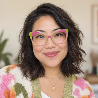 Alex Lee wearing colorful cat-eye glasses